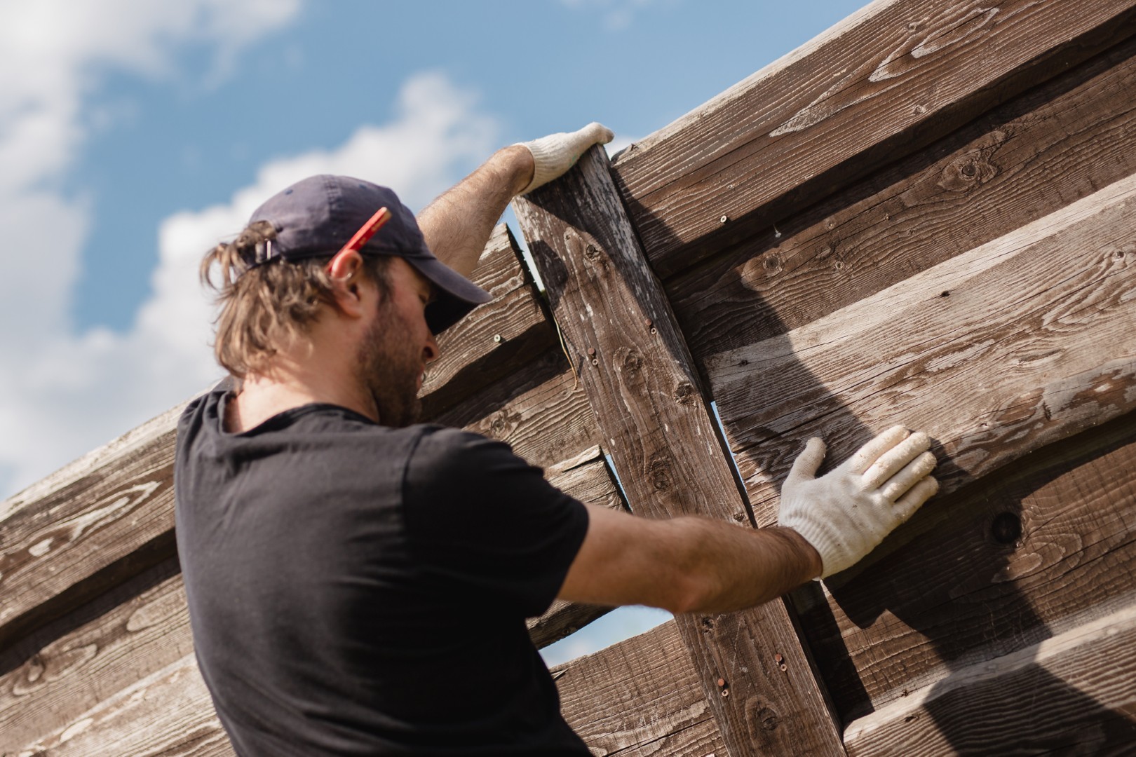 Man repairing fence